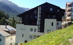 Haus-Armina-zermatt-exterior-view-in-summer-mountains-in-the-back