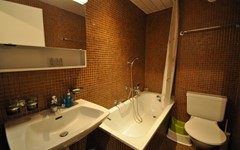 Haus-Gamma-studio-gamma-bathroom-with-bathtub-toilet-and-sink