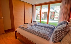 Casa-D'Amore-Zermatt-Bedroom-with-balcony-access-and-closet-for-private-use