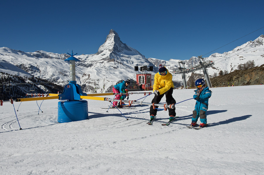 At the Wolli beginners' park in Zermatt, children are prepared for skiing and snowboarding while having fun.